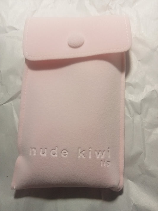 Pink suede-look pouch filled with the 2-pce lip-care items on white background.