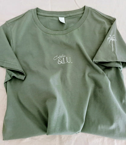 Green t-shirt with 'Ella & Lu' branding on a light background