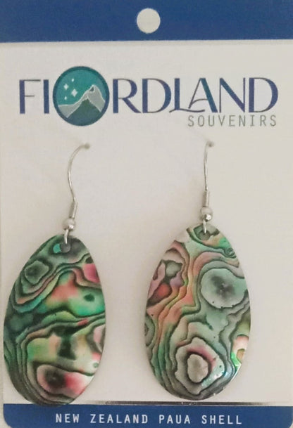 Pair of New Zealand paua shell earrings on a Flordland Souvenirs card.