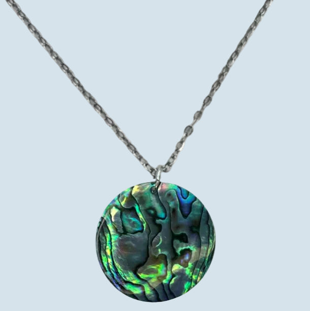 Necklace with a colorful abalone shell pendant on a white background