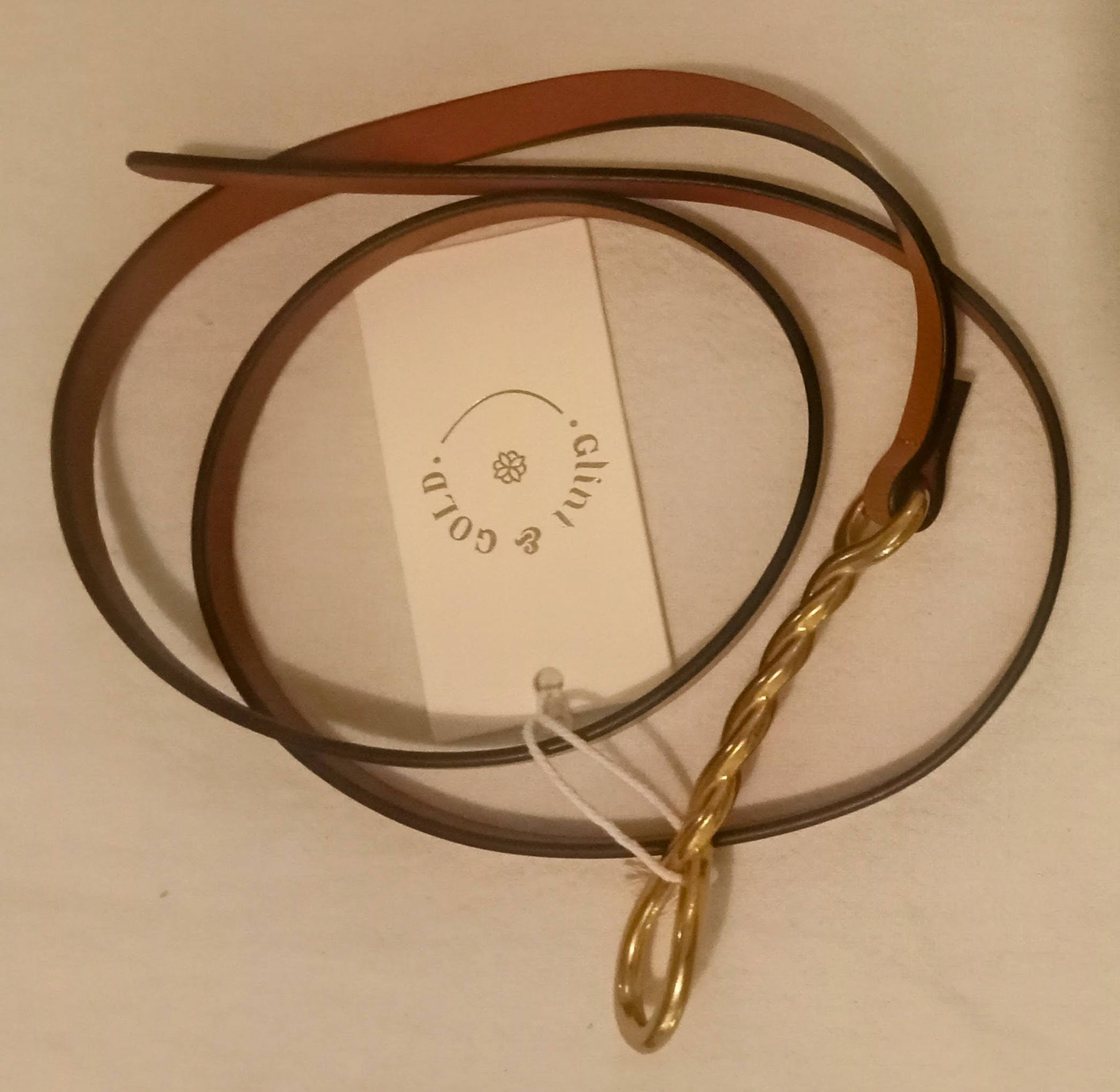 G&G Olivia belt - loosely curled on flat surface
