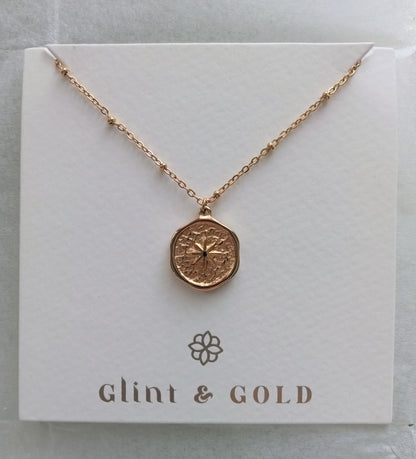 Rose gold necklace on a 'Glint & Gold' branded card