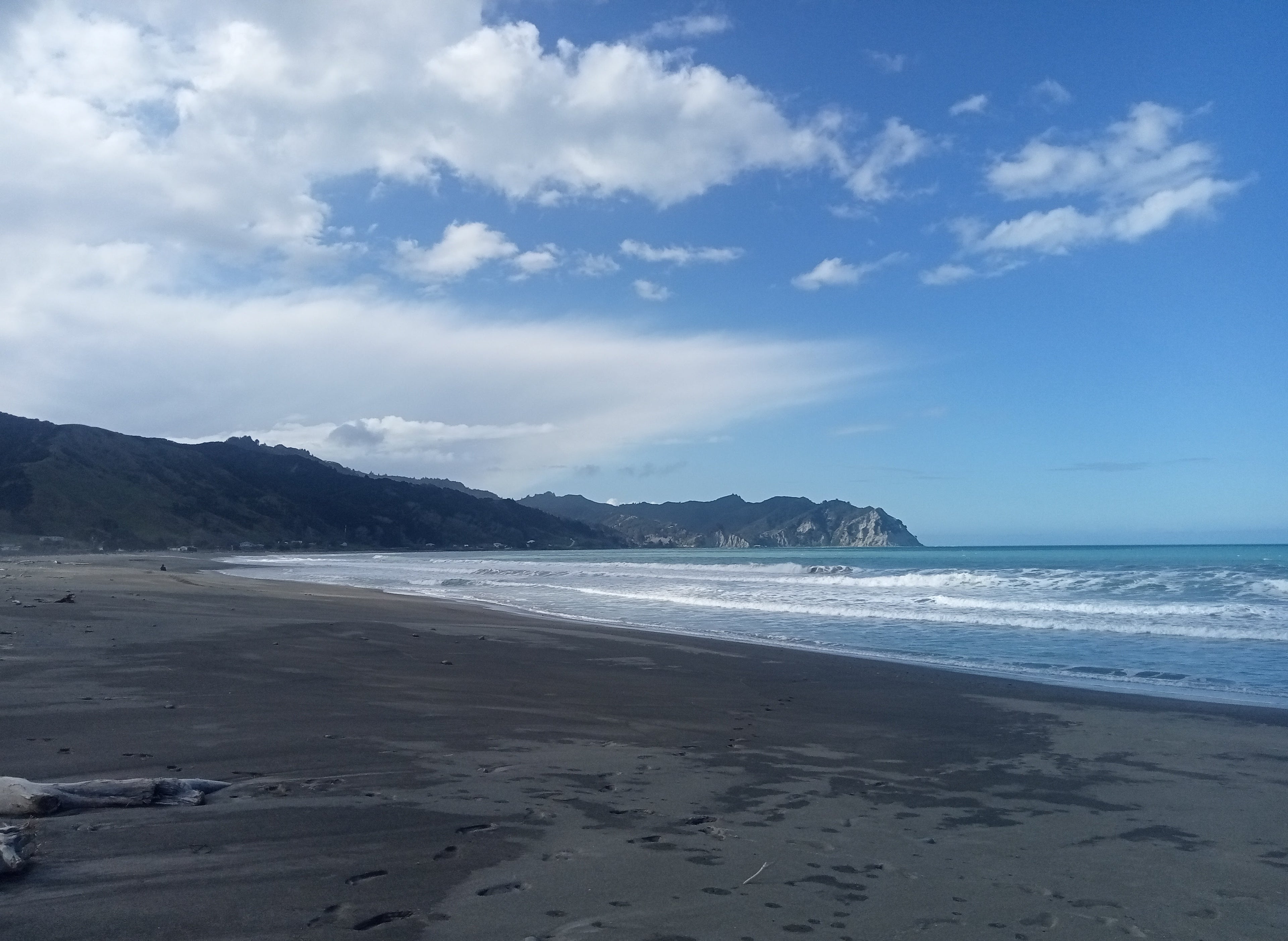 Tokomaru Bay, Gisborne with mountains and blue sky