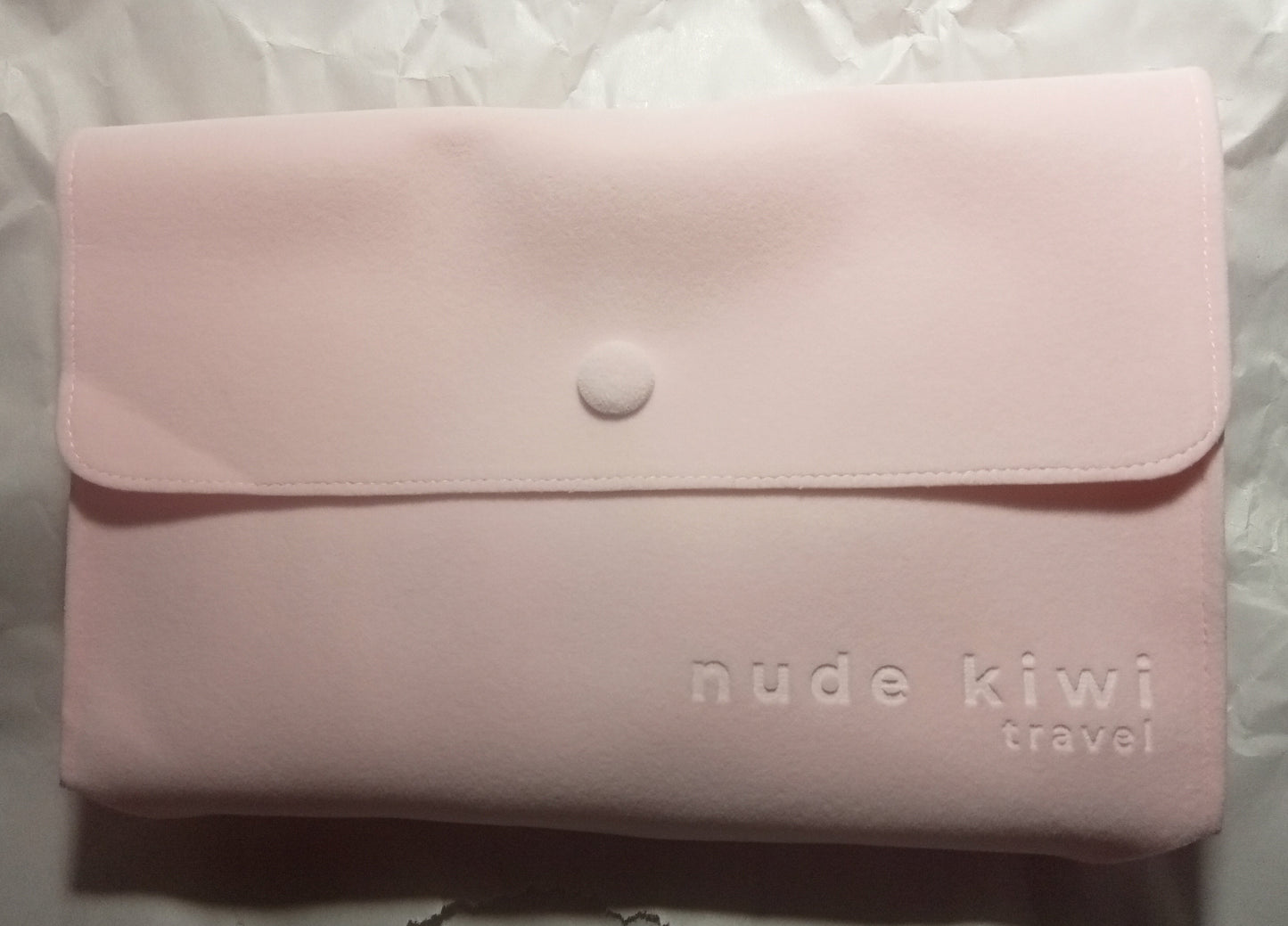 pink suede-look travel-pouch for skincare set (contains 4 items)