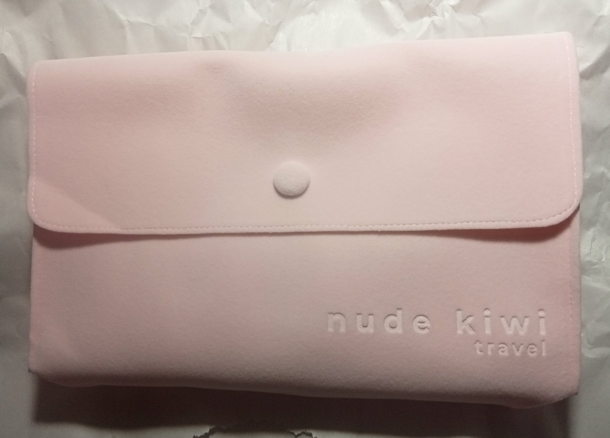 pink suede-look travel-pouch for skincare set (contains 4 items)
