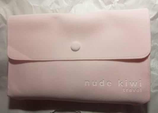 pink suede-look travel-pouch for skincare set (contains 4 items)