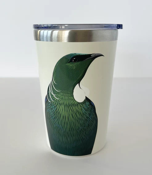 Drinking cup with a green Tui design on a white background